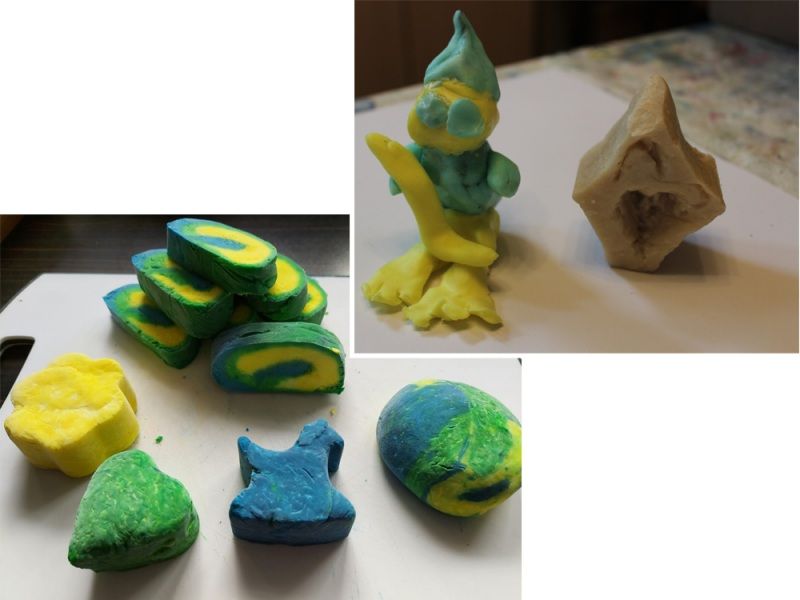 Verschiedene bunte Knetfiguren und geformte Stücke in Gelb, Grün und Blau sind zu sehen