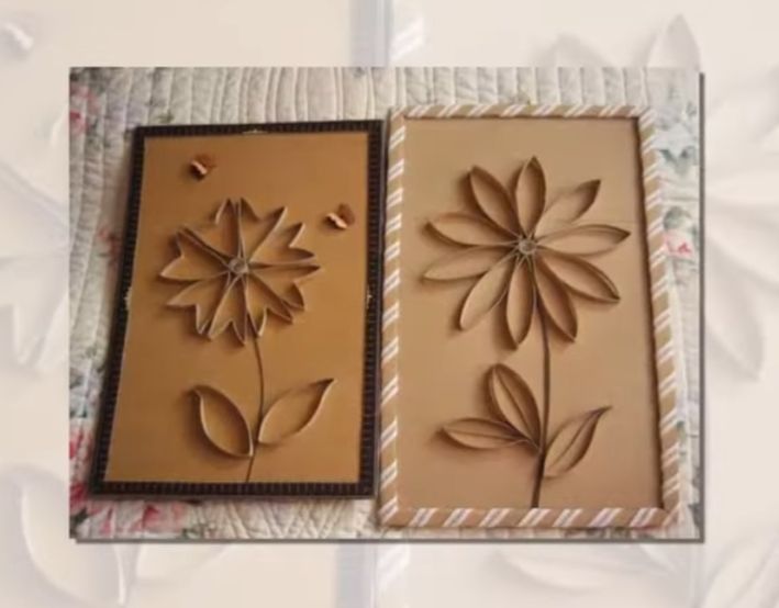 Zwei braune Papierbilder mit Blumenrelief und dekorativen Rahmen in Beige